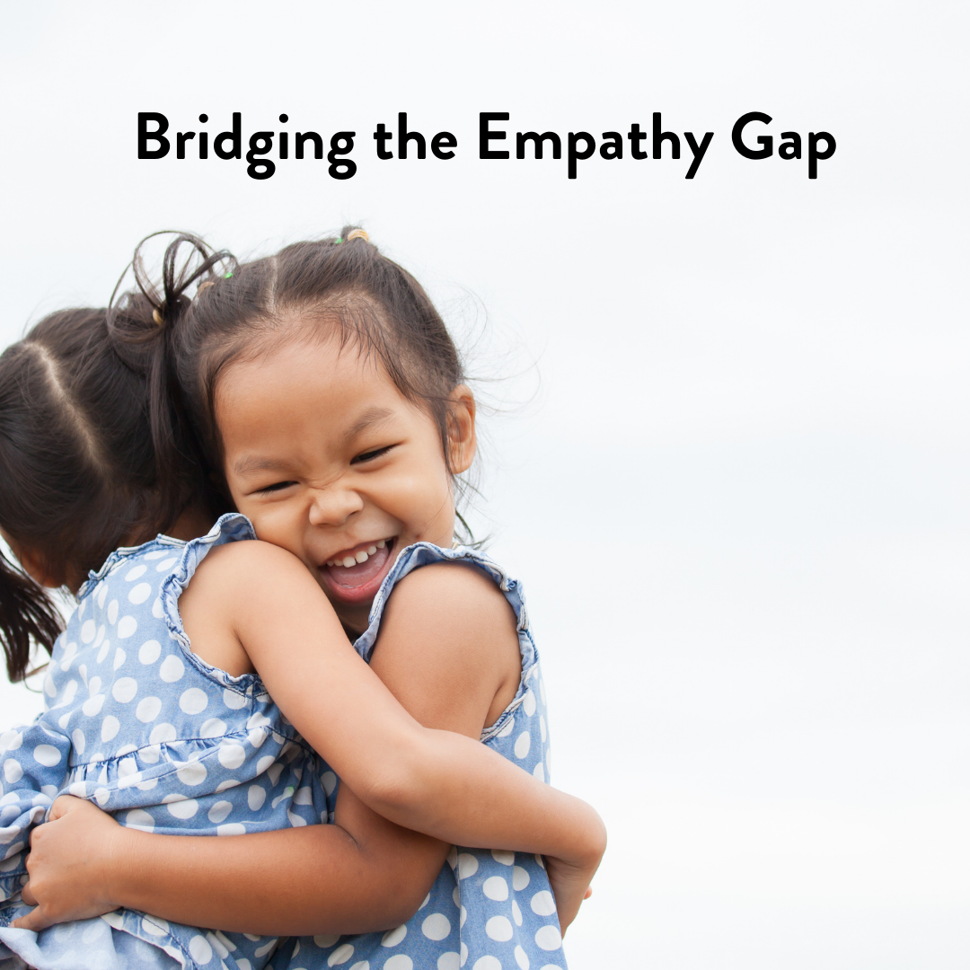 Two kids hugging. One is pictured smiling. The text "Bridging the empathy gap" is above them.