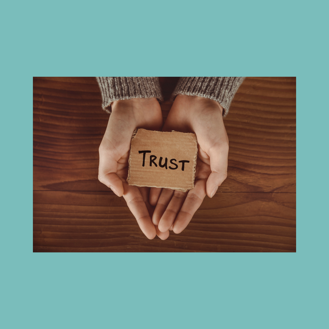 The word trust in someone's hands.