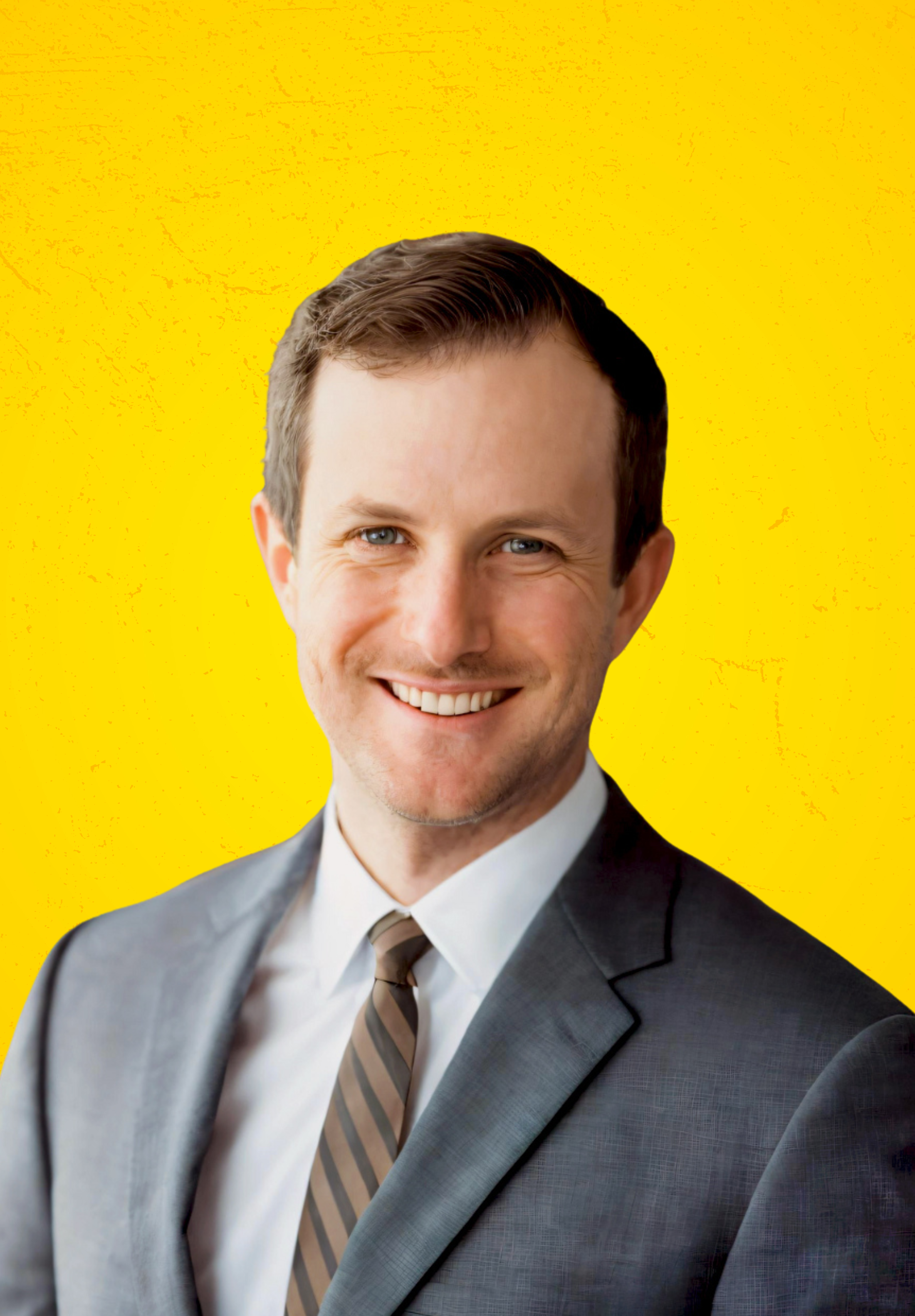 Headshot of Kyle Pendergast with yellow background.