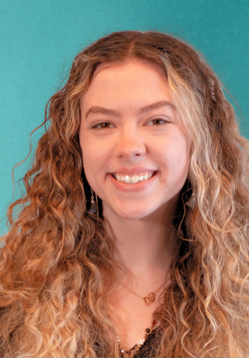 Hailey Taylor headshot with blue background